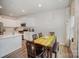 Open kitchen and dining area featuring modern appliances and a chef-themed painting at 18026 Stark Way, Charlotte, NC 28278