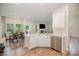 Bright kitchen features stainless steel appliances, white cabinetry, and adjacent dining area at 18026 Stark Way, Charlotte, NC 28278