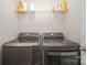 This laundry room features a modern washer and dryer set at 18026 Stark Way, Charlotte, NC 28278