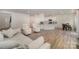 Open-concept living area with a kitchen, dining area, and hardwood flooring throughout at 18026 Stark Way, Charlotte, NC 28278