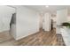 The open-concept design reveals seamless flow between spaces, enhanced by sleek flooring and modern fixtures at 18026 Stark Way, Charlotte, NC 28278
