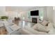 Inviting living room featuring a fireplace, hardwood floors, and plenty of natural light at 18026 Stark Way, Charlotte, NC 28278