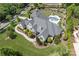 An aerial view of the house featuring a backyard oasis with a pool, spa, and lush landscaping at 18207 Shearer Rd, Davidson, NC 28036