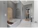 Bathroom with tub, tile backsplash, and shelving at 18207 Shearer Rd, Davidson, NC 28036