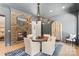 Dining room with fireplace, TV, round table, and decorative lighting fixture at 18207 Shearer Rd, Davidson, NC 28036
