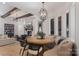 Bright dining area featuring custom seating, modern lighting, and views into the living room and kitchen at 18207 Shearer Rd, Davidson, NC 28036