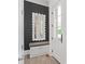 Welcoming entryway with custom mirror, bench seating, and neutral paint, and tiled floors at 18207 Shearer Rd, Davidson, NC 28036