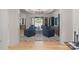 Living room with modern lighting, an open floor plan, and seamless flow to the outdoor pool area at 18207 Shearer Rd, Davidson, NC 28036