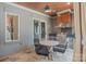 Inviting outdoor kitchen area with stainless grill, tile backsplash, and cozy dining set, perfect for entertaining at 18207 Shearer Rd, Davidson, NC 28036
