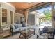 Covered outdoor living space with fireplace, ceiling fan, furniture and view of pool at 18207 Shearer Rd, Davidson, NC 28036