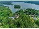 Aerial view of property with a home surrounded by lush trees at 18311 Rosapenny Rd, Charlotte, NC 28278
