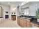 Spacious bathroom featuring a double sink vanity, tile floors, and separate shower and tub at 18311 Rosapenny Rd, Charlotte, NC 28278