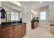 Bathroom features a double sink vanity, tile floors, and mirrors at 18311 Rosapenny Rd, Charlotte, NC 28278