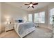 Bedroom with white furniture, lots of natural light and a ceiling fan at 18311 Rosapenny Rd, Charlotte, NC 28278