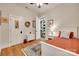 Cozy bedroom with hardwood floors, decorative rug, and walk-in closet at 18311 Rosapenny Rd, Charlotte, NC 28278