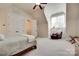 Bedroom featuring carpeted floors, a ceiling fan, and a walk-in closet at 18311 Rosapenny Rd, Charlotte, NC 28278