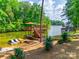 Multi-level deck and dock with boat slip, jet ski lifts, and seating offering lakeside fun at 18311 Rosapenny Rd, Charlotte, NC 28278