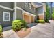 Exterior view showing a home's two car garage and entrance at 18311 Rosapenny Rd, Charlotte, NC 28278