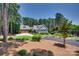 Spacious home with a three car garage, lush lawn, and established landscaping at 18311 Rosapenny Rd, Charlotte, NC 28278
