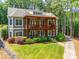 Aerial shot of house with large yard, wooded area and exterior entertainment space at 18311 Rosapenny Rd, Charlotte, NC 28278
