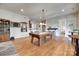 Spacious game room featuring a pool table and hardwood floors at 18311 Rosapenny Rd, Charlotte, NC 28278