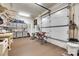 Garage featuring workbench and tools with ample storage space and garage door at 18311 Rosapenny Rd, Charlotte, NC 28278