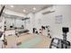 Workout room with mounted TV, free weights, and exercise machines at 18311 Rosapenny Rd, Charlotte, NC 28278