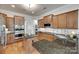 Modern kitchen with granite countertops, stainless steel appliances, and ample cabinet space for a chef's delight at 18311 Rosapenny Rd, Charlotte, NC 28278