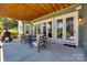 Outdoor patio area with seating and view through sliding glass doors into the home at 18311 Rosapenny Rd, Charlotte, NC 28278