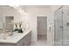 Bathroom features double sinks, quartz countertops, a walk-in shower with marble tile, and a walk-in closet at 2043 Skyhawk Dr, York, SC 29745