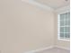 Bright empty bedroom with neutral walls, white trim, and a window with natural light at 2043 Skyhawk Dr, York, SC 29745