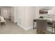 Inviting hallway with light wood flooring, white walls, decorative molding, and a glimpse of the front door at 2043 Skyhawk Dr, York, SC 29745