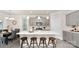Well-appointed kitchen featuring a center island with seating, stainless steel appliances, and gray cabinets at 2043 Skyhawk Dr, York, SC 29745