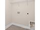 A utility room with tile flooring and shelving ready for washer/dryer hookups at 2043 Skyhawk Dr, York, SC 29745
