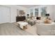 Bright living room featuring neutral furniture, large windows, a stylish coffee table, and contemporary decor at 2043 Skyhawk Dr, York, SC 29745