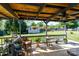 Back porch featuring outdoor furniture, hanging plants and views of the backyard at 205 Wrentree Ln, Gastonia, NC 28056
