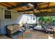 Relaxing back porch with comfortable seating and an outdoor rug at 205 Wrentree Ln, Gastonia, NC 28056