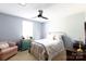Comfortable bedroom with a cozy sitting area, bright window, and neutral color scheme at 205 Wrentree Ln, Gastonia, NC 28056