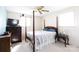 Serene bedroom with a four-poster bed, soft natural light, and calming color palette at 205 Wrentree Ln, Gastonia, NC 28056
