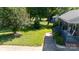 Charming front yard with lush green lawn, landscaping, a sidewalk, and a home with a blue porch at 205 Wrentree Ln, Gastonia, NC 28056