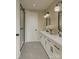 Elegant bathroom with double vanity, sleek black fixtures, modern mirrors, and glass enclosed shower at 2430 Arty Ave # 5B, Charlotte, NC 28208