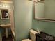 Cozy bathroom with pedestal sink, bathtub and toilet with tiled wall at 269 Saddle Rd, Lancaster, SC 29720