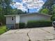 Exterior view of the home with a concrete driveway and a small set of stairs leading to a white door at 269 Saddle Rd, Lancaster, SC 29720