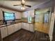 Functional kitchen with wooden countertop and bright white cabinets, providing an open view to the carpeted living area at 269 Saddle Rd, Lancaster, SC 29720