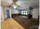 Bright living room with hardwood and carpeted floors, adjacent to kitchen and features multiple windows at 269 Saddle Rd, Lancaster, SC 29720
