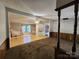 Inviting living room featuring an open layout with hardwood and carpeted floors, seamlessly connecting to the kitchen at 269 Saddle Rd, Lancaster, SC 29720