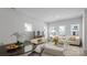 Bright living area with modern furnishings, large windows, and an adjacent dining space for entertaining at 2910 Sloan Dr, Charlotte, NC 28208