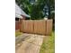 Fenced backyard area with a wooden fence, providing privacy and security for outdoor activities at 2939 Lasalle St, Charlotte, NC 28216