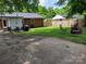 View of backyard with partial fence, patio, and seating, great for entertaining at 2939 Lasalle St, Charlotte, NC 28216