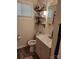 This bathroom features a modern vanity, toilet, and open shelving providing plenty of storage at 2939 Lasalle St, Charlotte, NC 28216